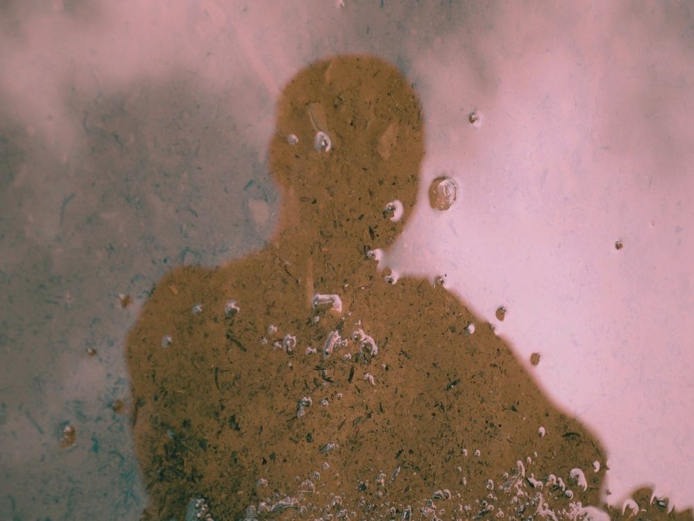 1000 x 750 A distorted image of a human figure against a messy background signifying the reality of toxic stress and trauma injuries.